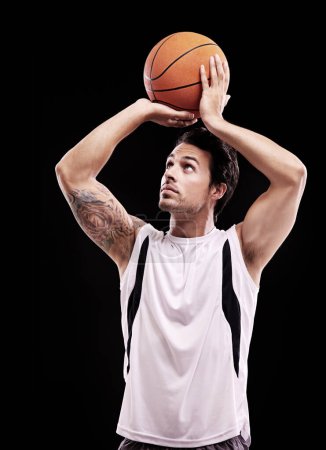Photo for Basketball, shooting and man in studio with fitness, training or game target practice on black background. Sports, exercise or male player with handball for body workout, performance or aim challenge. - Royalty Free Image