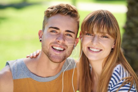 Photo for Couple, portrait and listening to music with earphones in garden, park or relax in summer with technology. Happiness, man and woman hearing radio, audio and sound together outdoor with love and care. - Royalty Free Image