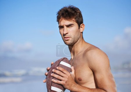 Photo for Football, serious man and fitness at the beach on holiday and vacation in Brazil by a sea. Travel, sport and exercise on the sand of a male person with workout, summer and training outdoor by ocean. - Royalty Free Image
