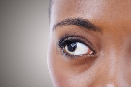 Photo for Half, face and eye of woman with vision for contact lenses and healthcare in studio background mockup. Optometry, eyesight and African model seeing, visual or search perception in optical exam. - Royalty Free Image