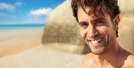 Photo for Man, smile and portrait at the sea on a holiday and vacation outdoor with travel on adventure. Happy, beach and male person in Bali by the ocean with confidence and freedom from trip and journey. - Royalty Free Image
