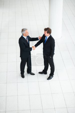 Photo for Business people, shaking hands and thank you for interview in introduction, hello and opportunity. Partnership, onboarding and b2b in agreement, top view and promotion in office or collaboration. - Royalty Free Image