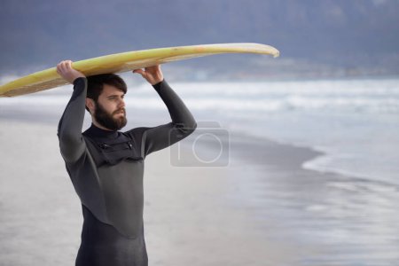 Photo for Surfboard, thinking and man on beach for surfing on vacation, holiday and weekend in ocean. Nature, waves and person in wetsuit for water sports, hobby and exercise for adventure and freedom in sea. - Royalty Free Image