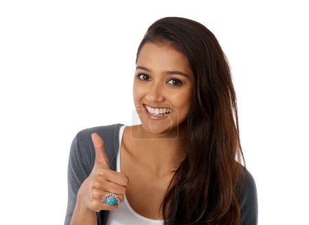 Photo for Woman, portrait and happy with thumbs up in studio for thank you, support or hand gesture with mockup space. Person, yes emoji and agreement for achievement, winning or success with white background. - Royalty Free Image