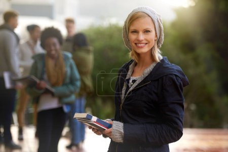Photo for Woman, portrait and student outdoor with books for studying, learning and education for academic growth. Knowledge, scholarship and degree with smile on campus, college with textbook or folder. - Royalty Free Image