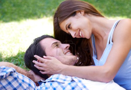 Photo for Man, woman and relax in park for holiday in summer bonding or weekend, happiness or outdoor. Happy couple, smile and embrace on blanket on grass lawn for dating connection or rest, love or London. - Royalty Free Image