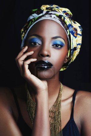 Photo for Black woman, wrap and portrait with fashion, makeup and beauty in studio. Cosmetics, trendy and art with African female person from Kenya with traditional head scarf accessory with dark background. - Royalty Free Image