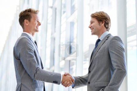 Photo for Men, colleagues and shaking hands or business agreement or collaboration on project, deal or promotion. Male people, networking and gesture for partnership at law firm or welcome, onboarding or unity. - Royalty Free Image