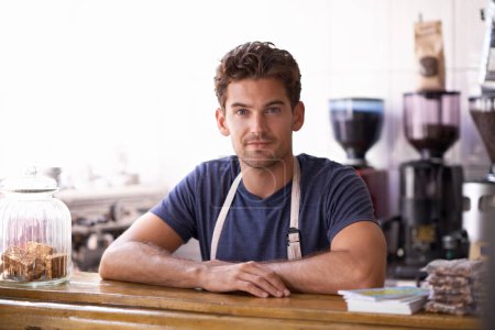 Photo for Man, barista and portrait in coffee shop, counter and working in restaurant or small business. Male person, entrepreneur and professional in bistro, confidence and pride in career and hospitality. - Royalty Free Image