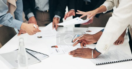 Photo for Business people, hands and paperwork at meeting with company information and project. Collaboration, office document and sales report of staff with teamwork, cooperation and planning with data. - Royalty Free Image