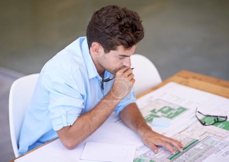 Photo for Architect, thinking or man in office with blueprint, brainstorming and reading paper for building project. Designer, engineer or creative developer at desk with floor plan for remodeling upgrade - Royalty Free Image
