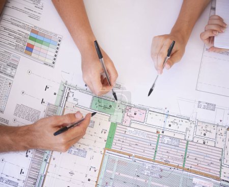 Photo for Architecture, hands and team in office with floor plan, strategy and project management meeting. Engineering, blueprint and people problem solving together in collaboration for remodeling from above. - Royalty Free Image