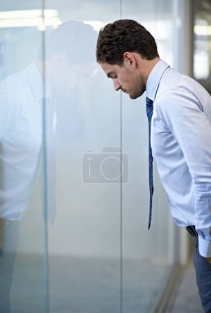 Photo for Man, business and leaning on glass wall with stress for financial deal failure or company, mistake or frustrated. Male person, unhappy and career error in New York building, burnout or overwhelmed. - Royalty Free Image