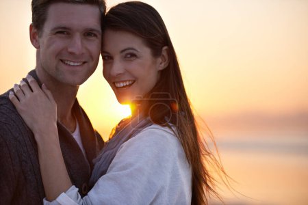 Photo for Couple hug, portrait and sunset on beach, travel for bonding and romance outdoor with love and trust. Happiness, support and loyalty with people in relationship, mockup space and adventure together. - Royalty Free Image