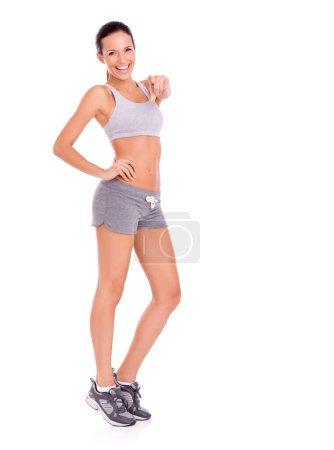 Photo for Studio, woman and pointing for workout promotion in portrait and exercise announcement or news of gym discount. Model, happy face and aerobics offer to winner and training plan by white background. - Royalty Free Image