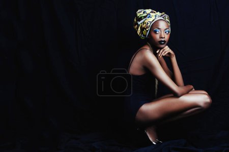 Photo for Black woman, turban and thinking with fashion, head scarf and mockup in studio. Cosmetics, trendy and style with African female person from Kenya with traditional silk wrap with dark background. - Royalty Free Image