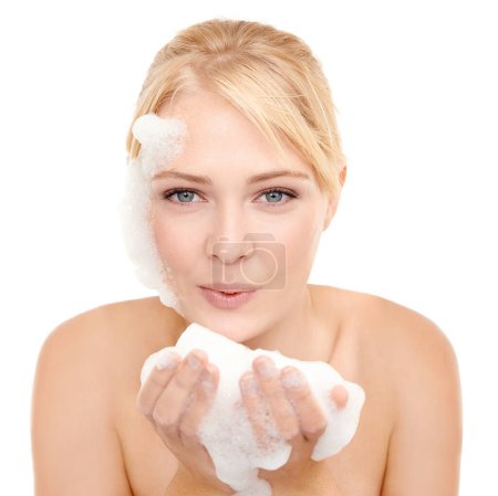 Photo for Female person, portrait and soap on face for skincare with face wash, cosmetics and foam for clear skin. Woman, white background and fresh for beauty, hygiene and treatment for wellness and self care. - Royalty Free Image