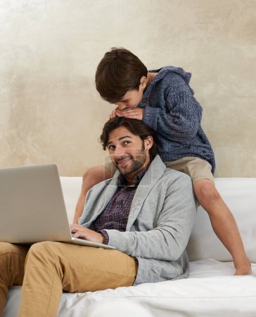 Photo for Father, son and laptop on sofa with love, playing and happiness for bonding in living room of home. Family, man and child with remote work, smile and relax on couch in lounge of house with trust. - Royalty Free Image
