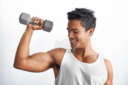 Photo for Gym, fitness and happy man with dumbbell in studio for weightlifting, sports or resilience on white background. Training, face or male bodybuilder with space for power, performance or bicep challenge. - Royalty Free Image