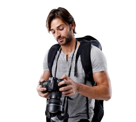 Photo for Man, camera and photography with technology in studio, press or media on white background. Photographer, photo journalist check work and creativity with paparazzi, equipment and backpack in studio. - Royalty Free Image