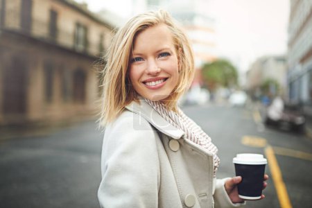 Photo for Happy, city and portrait of woman with coffee for morning commute, walking and journey in street. Travel, fashion and face of person with beverage, drink and cappuccino for adventure in urban town. - Royalty Free Image