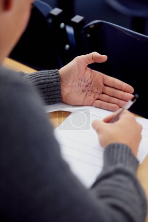Photo for Hand, test and cheating with answer for math exam in classroom for equations, geometry or education. Student, palm and formula note or paperwork for study assessment or university, secret or lying. - Royalty Free Image