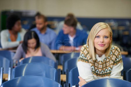 Photo for College, student and portrait in lecture, class and learning in course with education development. University, campus and people studying for test in school and reading project, research or knowledge. - Royalty Free Image