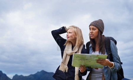 Photo for Woman, friends and thinking with map for lost direction, location or hiking adventure together in nature. Young female person, hiker or team with travel guide for destination, route or outdoor path. - Royalty Free Image