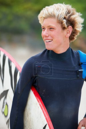 Photo for Man, surfer and face or happy outdoor with surfboard for adventure, vacation or holiday. Surfing, person and smile with travel in nature for exercise, water sports or swimming in summer with wetsuit. - Royalty Free Image