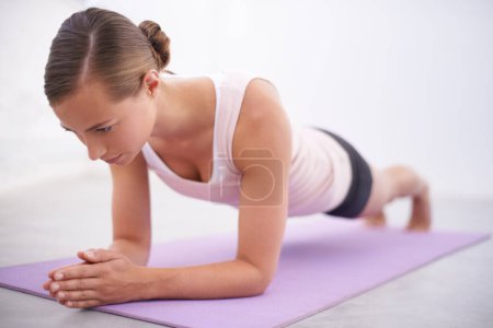 Photo for Yoga, pushup and woman with stretching for fitness, natural exercise and balance in home. Workout, pilates and healthy body of girl on mat for morning muscle warm up, wellness and self care mission - Royalty Free Image