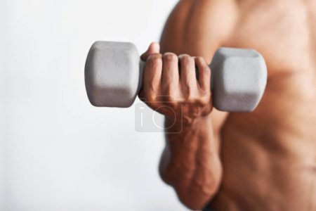Photo for Closeup, hand and man with dumbbell, exercise and weights training for wellness and endurance. Person, bodybuilder and guy with equipment and progress with fitness and strong with health and energy. - Royalty Free Image