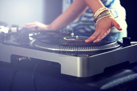 Photo for Hand, turntable and music for club performance as dj at techno rave for streaming audio track, hiphop or entertainment. Equipment, mix and record scratch for listening concert, playlist or weekend. - Royalty Free Image