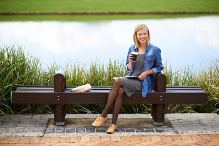 Photo for Coffee, park and portrait of woman on bench with newspaper for lunch break, relax and calm in nature. Happy, reading and person outdoors with caffeine drink, beverage and tea by lake on weekend. - Royalty Free Image