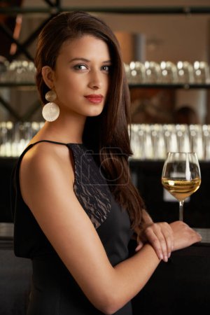Photo for Woman, portrait and bar counter at cocktail event with alcohol, fashion and fancy night. Drink, confidence and party with elegant and stylish clothing with glamour in a restaurant for fine dining. - Royalty Free Image