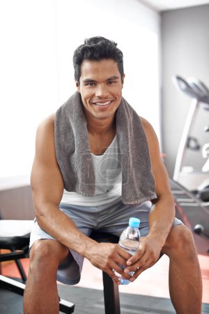 Photo for Happy, man and portrait at gym with water bottle for recovery after exercise and body building. Healthy, fitness or person relax after workout with liquid hydration for benefits to wellness in Mexico. - Royalty Free Image