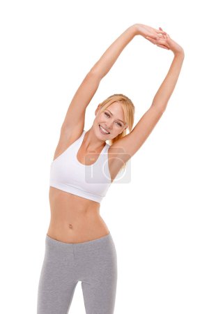 Foto de Mujer, retrato y brazo estirándose en estudio para hacer ejercicio de yoga con flexibilidad de salud, rendimiento o bienestar. Persona, rostro y pilates femeninos sobre fondo blanco para practicar, muscular o maqueta. - Imagen libre de derechos