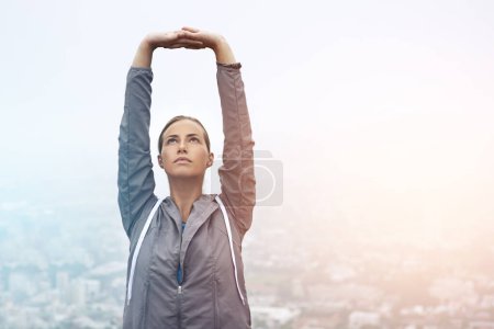 Photo for Exercise, running and stretching with sports woman outdoor in mountains for morning cardio training. Fitness, health and wellness with young runner or athlete getting ready for workout in mist. - Royalty Free Image