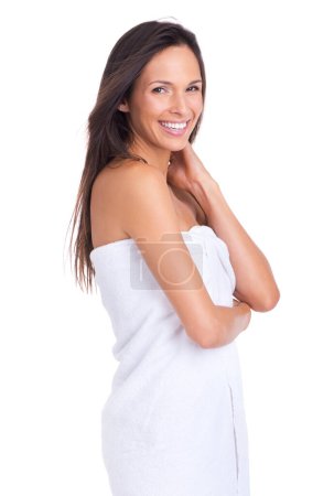 Photo for Woman, portrait and shower with towel from spa, treatment or morning routine in studio. Skincare, smile and body cleaning with arms crossed and dermatology with cosmetics and white background. - Royalty Free Image