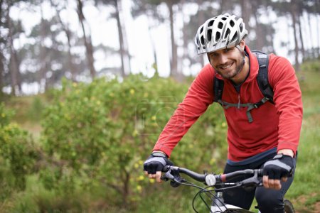Photo for Portrait, fitness and man cycling in countryside for adventure, discovery or off road sports hobby. Exercise, smile and health with young cyclist on bike in nature for cardio training or workout. - Royalty Free Image