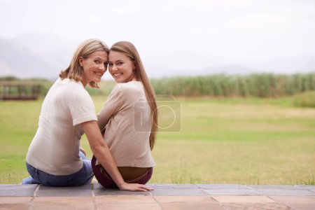 Photo for Women, mother and daughter in garden, portrait and together with smile, care and love on spring vacation in nature. Mom, girl and family with connection, bonding and love on patio at countryside home. - Royalty Free Image