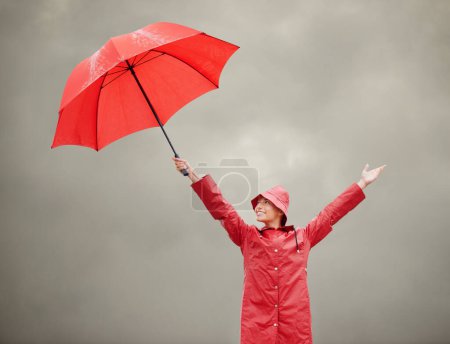 Photo for Woman, overcast and umbrella for security, outdoor nature and protection from rain in weather. Female person, insurance and safety or shield from storm, winter and travel for holiday or vacation. - Royalty Free Image