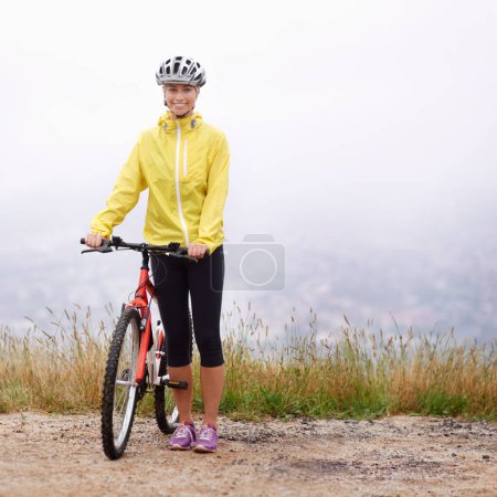 Photo for Portrait, smile and woman with bike in mountains for morning exercise, training or off road hobby. Cycling, fitness and sports with happy young athlete in countryside or nature for workout ride. - Royalty Free Image