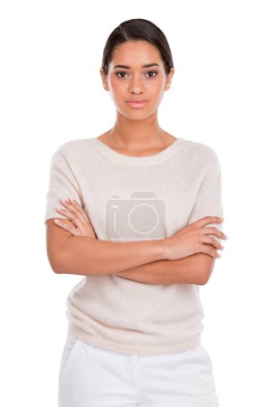 Photo for Portrait, fashion and serious woman with arms crossed in studio with confidence, attitude or style on white background. Clothes, pride or female model posing in trendy, cool or neutral outfit choice. - Royalty Free Image