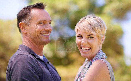 Photo for Portrait, couple and love with smile in outdoor in happiness, affection and romance for date. Park, relationship and together with bonding for care, satisfied and trust with commitment and support. - Royalty Free Image