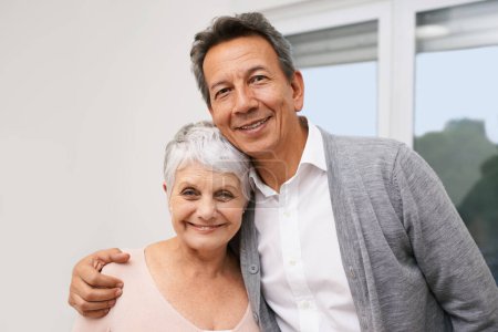 Photo for Hug, senior or portrait of happy couple in home for bonding together with support, love or smile. Retirement, people or romantic mature man with an elderly woman for trust, peace or care in marriage. - Royalty Free Image