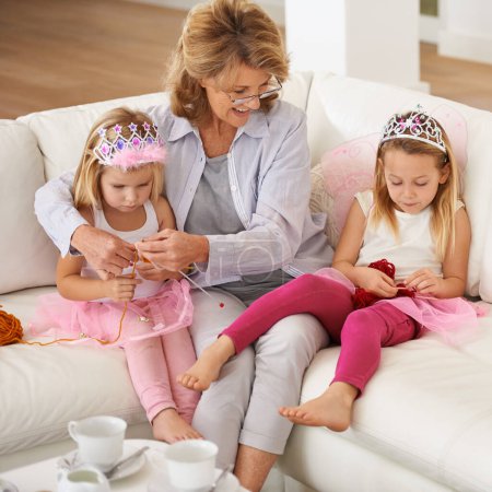 Photo for Knit, teaching and learning with grandmother and grandchildren at home for bonding and family time together. Help, advice and wool to crochet, woman relax with girl kids for knowledge and creativity. - Royalty Free Image