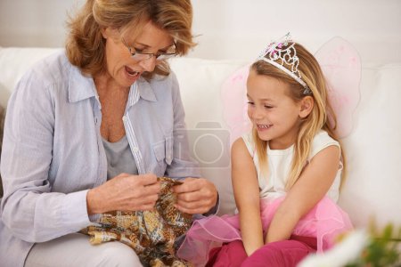 Photo for Grandmother, child and teaching knitting on sofa for creative pattern design for bonding connection, hobby or handmade. Woman, girl and fairy dress up at home for learning sewing, craft or sweater. - Royalty Free Image