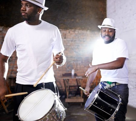 Night, drum or black people in band for carnival playing an instrument in festival in Rio de Janeiro. Brazil, show or group of male artists banging to create a beat in fun party or music performance.