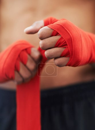 Photo for Closeup, hand and wrap for mma, protection and strength at fitness and workout studio in Thailand. Strap, fist and fingers to bandage and protect for exercise, training and competitive fighting. - Royalty Free Image