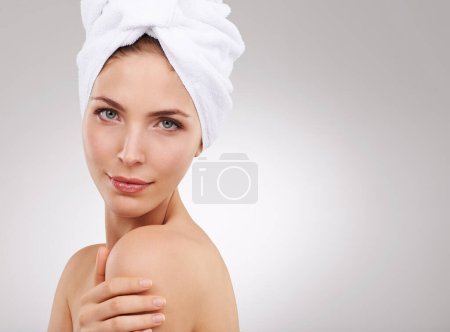 Photo for Beauty, skincare and portrait of woman with towel, natural glow and mockup space in studio. Dermatology, healthy skin and girl on white background with luxury facial, morning routine and cosmetics - Royalty Free Image